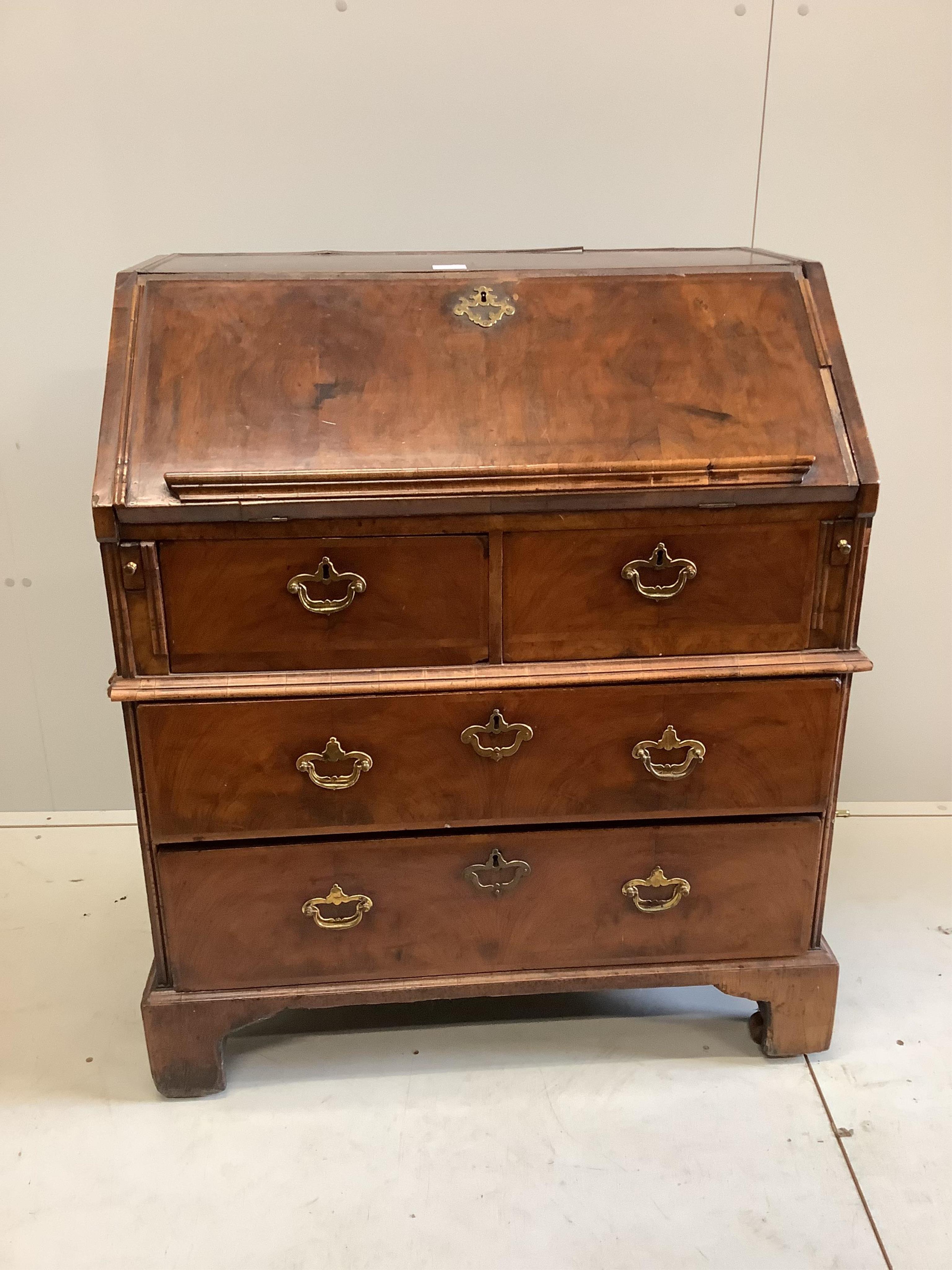 An 18th century feather banded walnut bureau, width 84cm, depth 51cm, height 101cm. Condition - poor